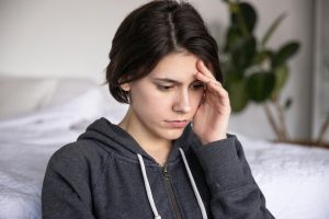Woman overthinking and feeling anxious in her home in Coquitlam