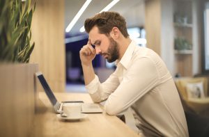 a man is feeling stressed from being too hard on himself